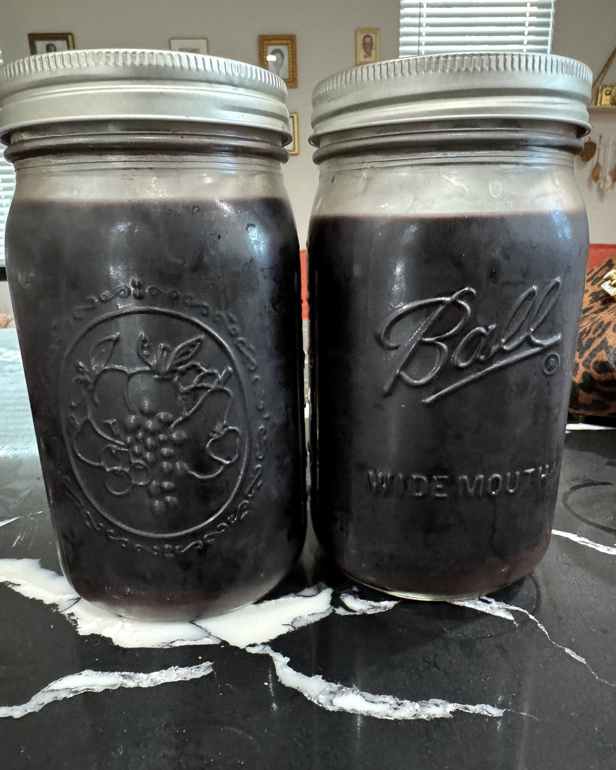 Small-batch elderberry syrup in 32 oz mason jars