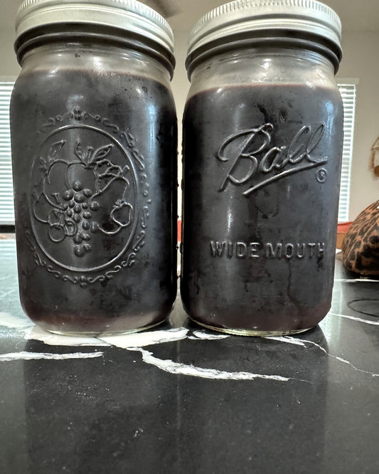 Two 32 oz mason jars of Essie’s Apothecary elderberry syrup